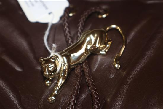 A Cartier Panthere textured brown leather shoulder bag, with signature gold-toned panther decoration to front